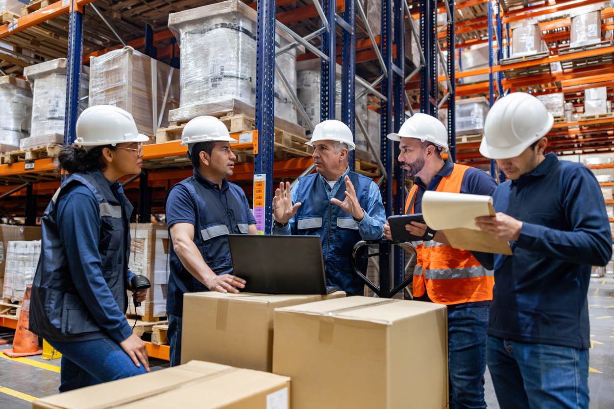Warehouse team discussing workforce operations